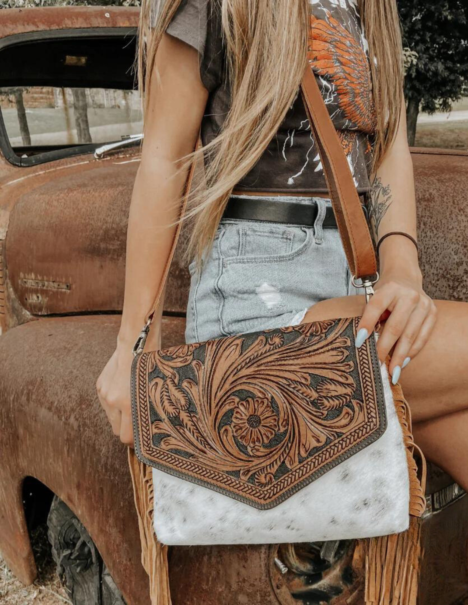 Cowhide purse sales with fringe